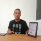 Kuasa hukum Suhardi, Yance Thobias Mesah, saat menunjukkan dokumen pencabutan surat keberatan, Kamis (23/4/2026) siang. Foto Rino/GBRNews.id
